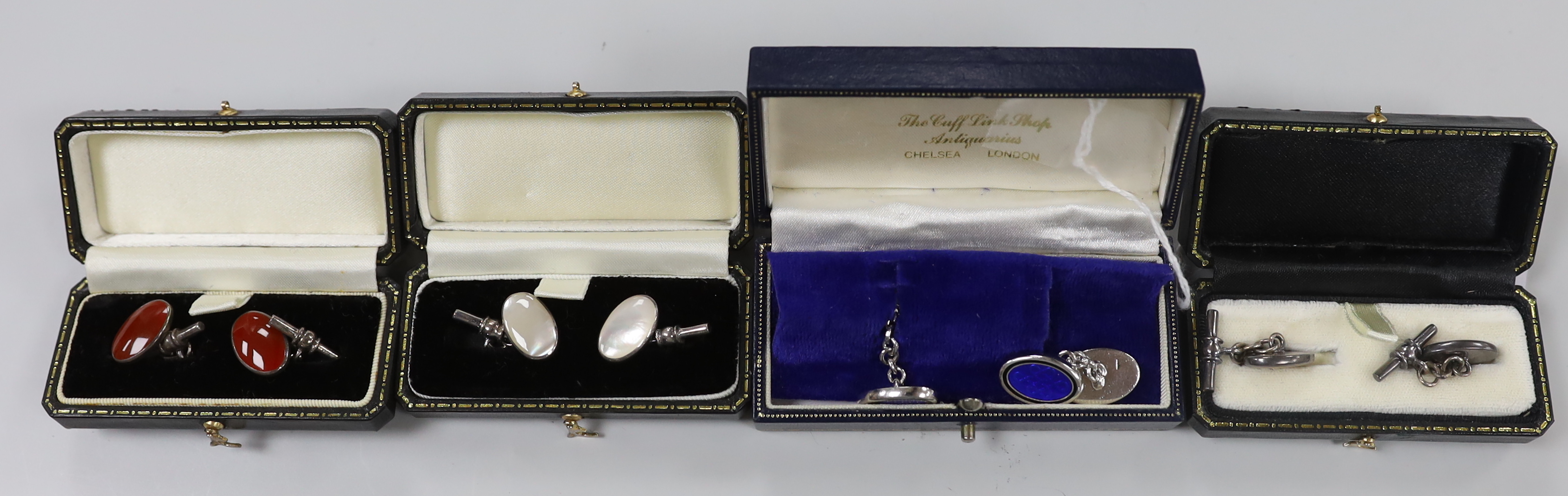 Four pairs of modern cufflinks including 925 and blue guilloche enamel and 925 and carnelian and two other white metal, set with tiger's eye quartz or mother of pearl.